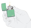 Classic High Polish Green Zippo Logo Windproof Lighter lit in hand