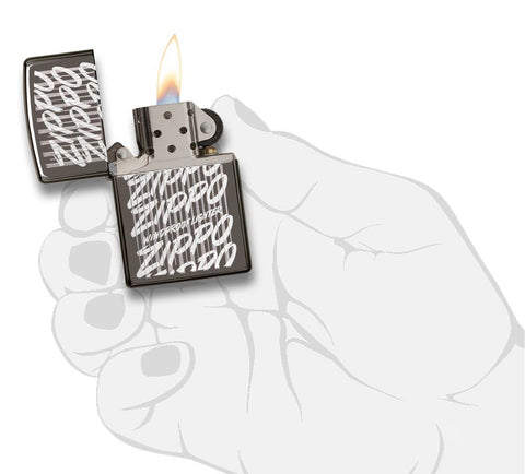 29631 Zippo Script Windproof Engraved Design on a Black Ice Lighter - In Hand, Open Lit