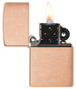 Zippo lighter basic model in brushed solid copper and black insert opened with flame