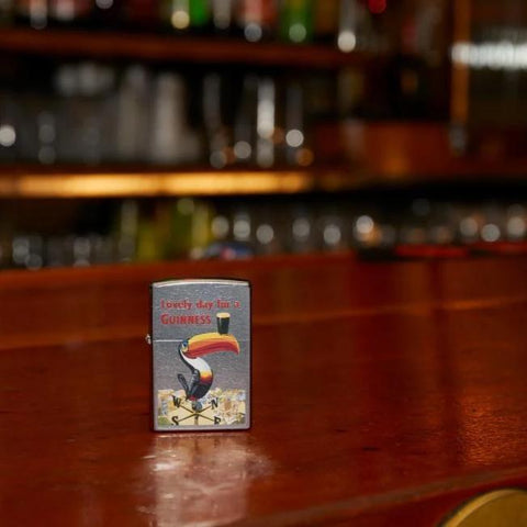 Lifestyle image of Guinness Vintage Toucan Lighter standing on bar