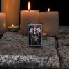 Lifestyle image of Anne Stokes Dragon Warrior Lighter standing on cobblestone with lit candles in the background
