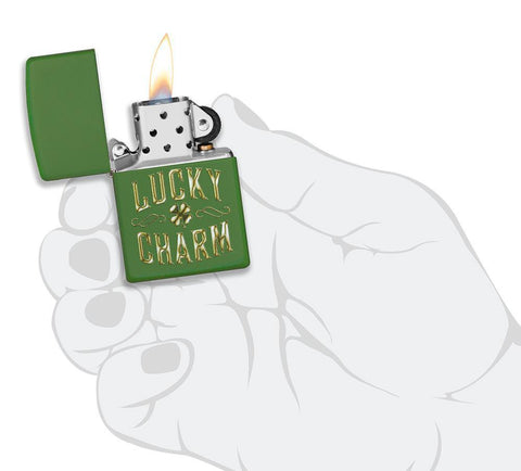 Lucky Charm Green Matte Windproof Lighter in hand and lit