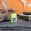 Lifestyle image of Mushroom Textured Print Neon Yellow Windproof Lighter with incense in the background
