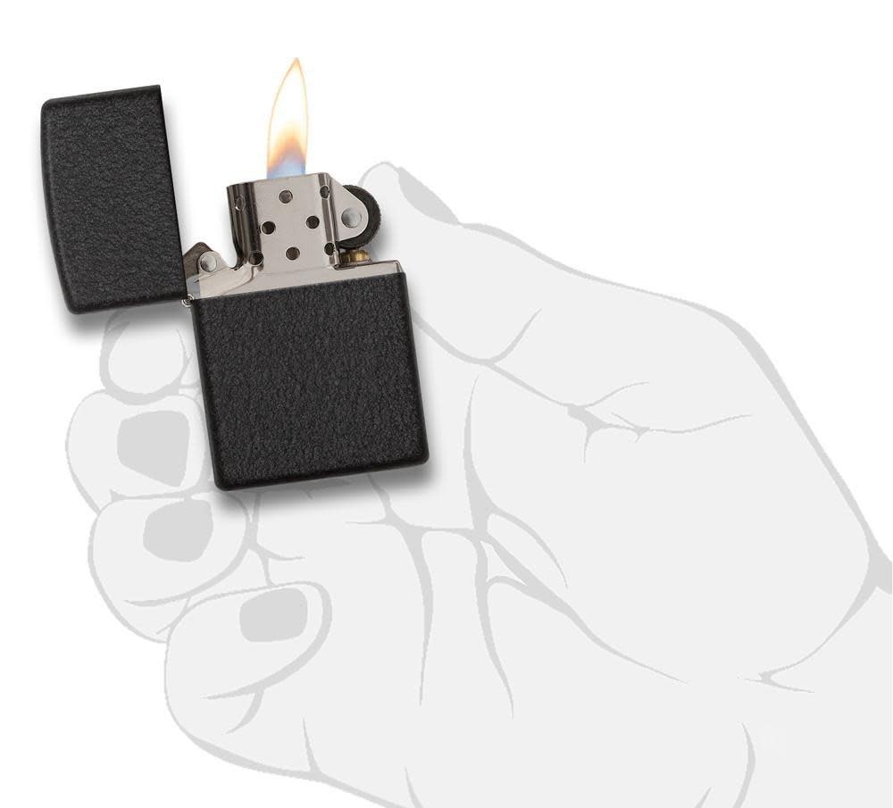 Front view of the Black Crackle® Lighter in hand, open and lit