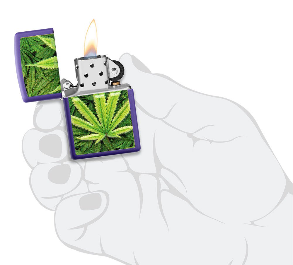 Cannabis Design Texture Print Leaf Purple Matte Windproof Lighter lit in hand.