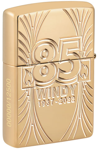 Back shot of Zippo Windy 85th Anniversary Collectible Armor High Polish Brass Windproof Lighter, standing at a 3/4 angle.