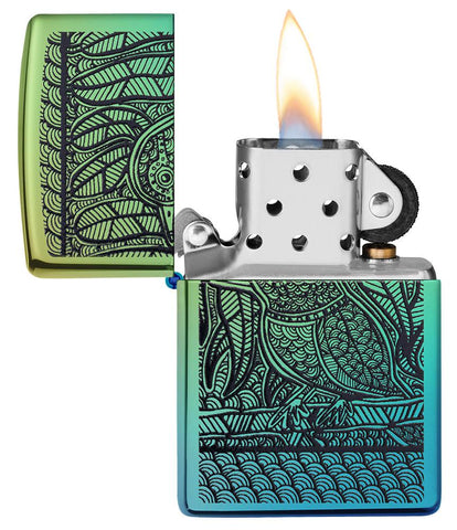 John Smith Gumbula Bird High Polish Teal Windproof Lighter with its lid open and lit