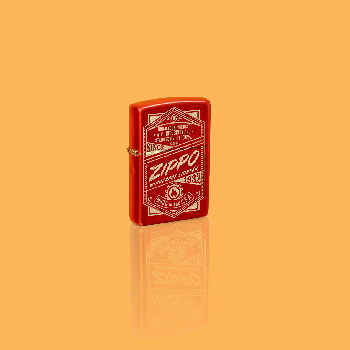 Glamour shot of Zippo It Works Design Metallic Red Windproof Lighter standing in a yellow scene.